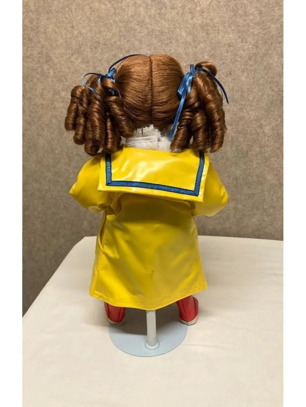 The Danbury Mint 'Kelly' Porcelain Doll with Blue Umbrella and Yellow Raincoat